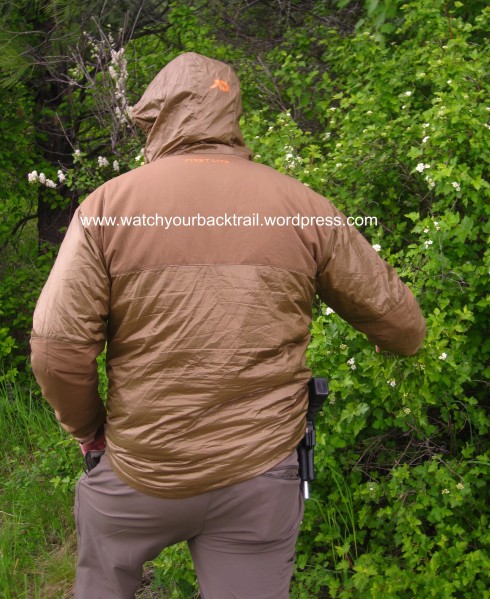 A backside view of the Puffy illustrates the use of more hardy materials in high wear areas; i.e. the Merino Wool panel across the upper back. You can also appreciate the athletic cut; which lends to easy layering when using an outer layer. It also cuts out useless bulk, which keeps the weight down.