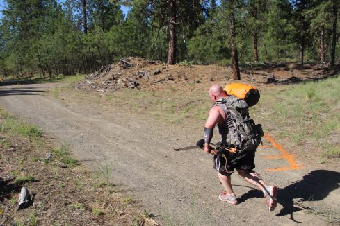 100 yard "shuttle run", with a 70# sandbag. One of the easier challenges.